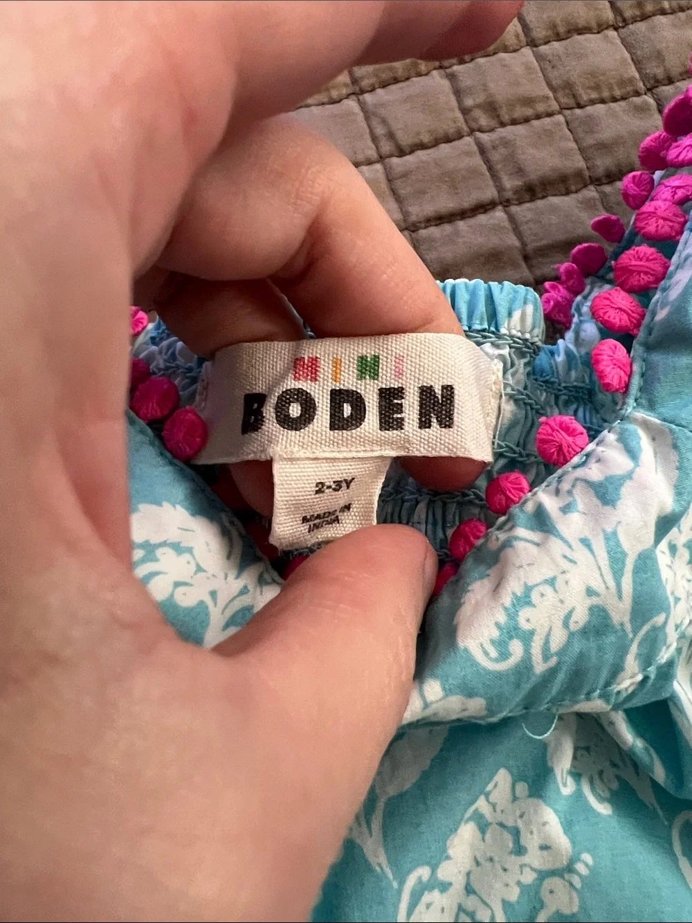 MINI BODEN Girls Aqua Floral Romper with Pink Pom-Trim